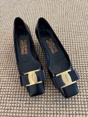 Authentic Salvatore Ferragamo Black Leather Bow  with Gold Hardware